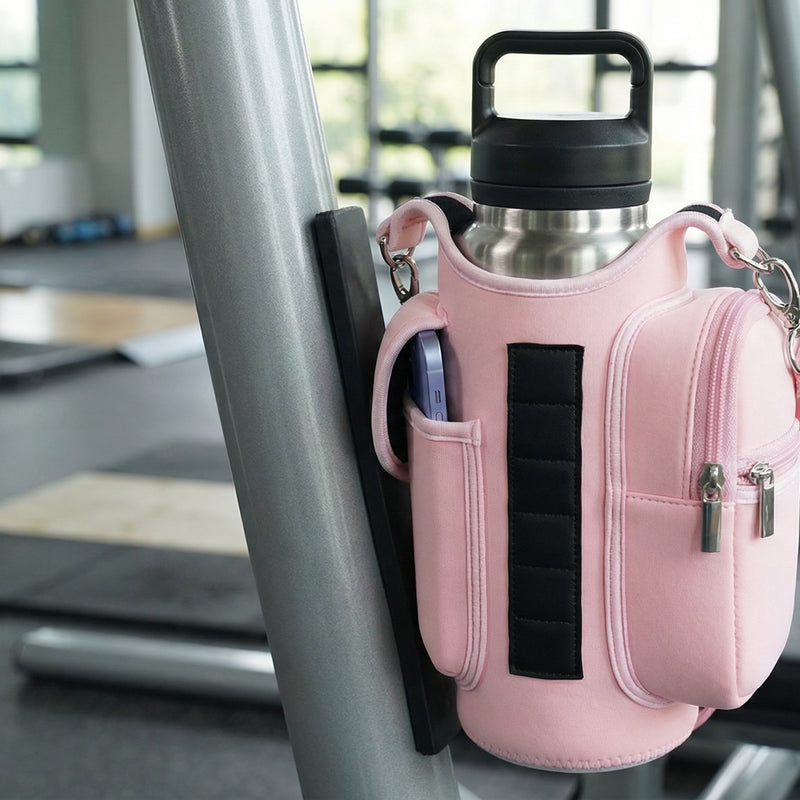 Pink crossbody bag attached to a metal bar in a gym setting