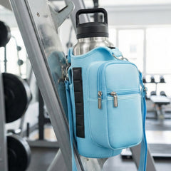 blue crossbody bag attached to a metal bar in a gym setting