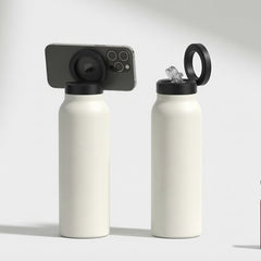 Set of white water bottles with black lids on a white background